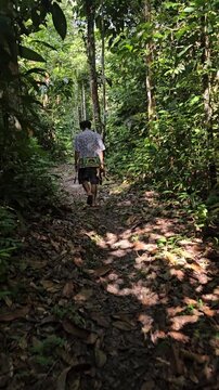 shaman walking throught jungle