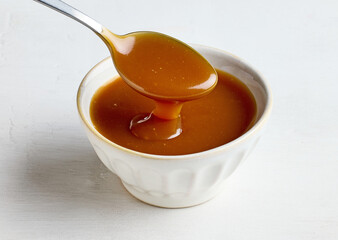 bowl of freshly cooked homemade caramel sauce
