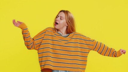 Tired young woman going to sleep laying down on his palms, yawning, dozing off during day taking nap and resting, comfortable bedtime, falling asleep. Adult girl isolated on yellow background indoors