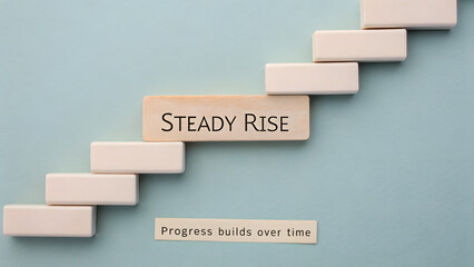 Blocks arranged as steps representing steady rise and progress