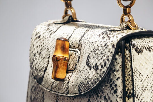 Nice, France - August 2, 2025: Iconic Gucci Bamboo handbag displayed in a luxury fashion store window, featuring the signature bamboo handle and textured leather design