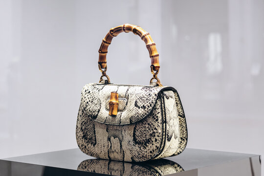 Nice, France - August 2, 2025: Iconic Gucci Bamboo handbag displayed in a luxury fashion store window, featuring the signature bamboo handle and textured leather design