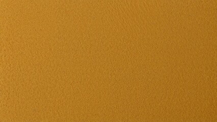 Naklejka premium A textured surface in a warm brown or gold color.