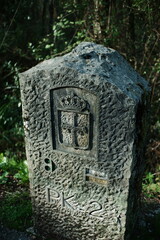 Stone boundary marker milestone on a hiking trail in Asturias, Spain