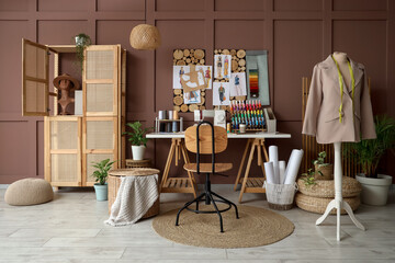 Interior of atelier with tailor's workplace, closet and mannequin