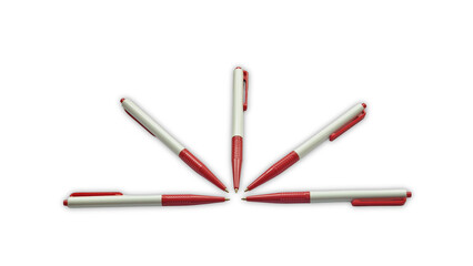 Red and white ballpoint pens forming a radial pattern