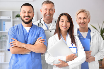 Naklejka na ściany i meble Team of smiling doctors in clinic