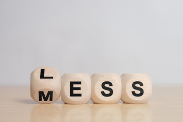 Less mess words on wooden blocks.