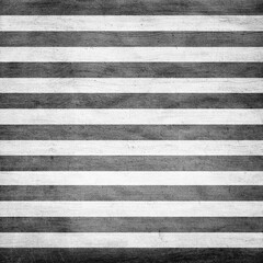 Fototapeta premium Black and white striped fabric texture, vintage grunge canvas pattern, bold horizontal stripes ideal for fashion design, backgrounds, and graphic layouts.