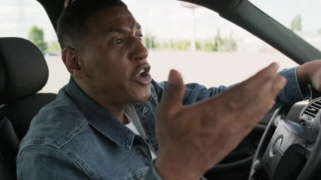 Angry male driver driving car and screaming to pedestrian. Slow motion
