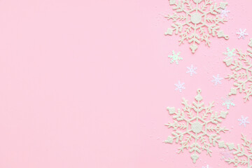 Beautiful decorative snowflakes on pink background