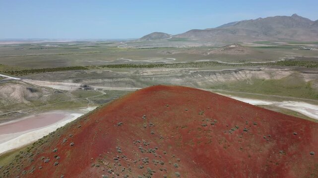 Drone aerial view of Lake Meke drying volcanic crater lake with red landscape in Turkey