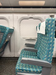 Modern Train Seating: Side view of spacious and comfortable seats on a high-speed rail car