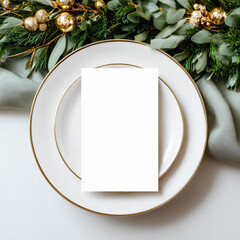 Elegant blank menu mockup placed on a white plate with gold trim, styled with green foliage for a festive table setting