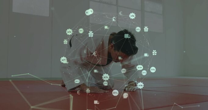 Adult male practitioner in gi shifting hands, overlay nodes intensifying and rising while preparing