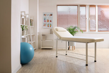 Interior of rehabilitation center with couch and shelf units