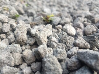 Close-up natural rough black granite stone texture abstract surface pattern