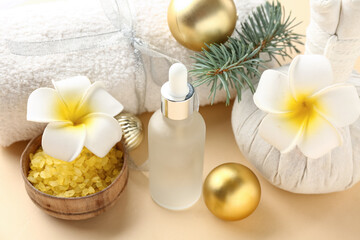 Beautiful spa composition with Christmas decorations on color background, closeup