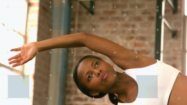 Trainer raising right arm and deepening side-stretch for fitness, overlays aligning with torso