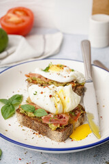 Plate of tasty sandwiches with egg on grey background