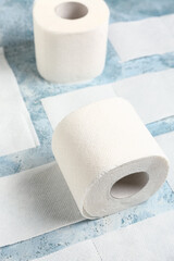 Rolls of toilet paper on blue background