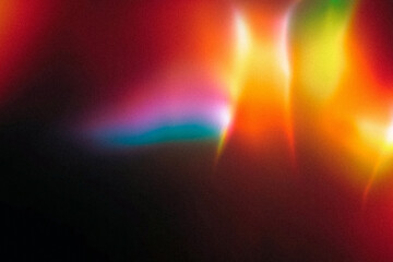 light leak overlay effect with dust and blur colorful light ,retro noisy film texture light leak flare on black background,abstract background with colorful light,grunge old film background