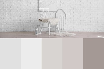Chair, lanterns and sled near white brick wall in room. Different color patterns
