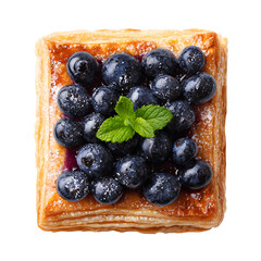Delicious square pastry topped with fresh blueberries and mint leaf