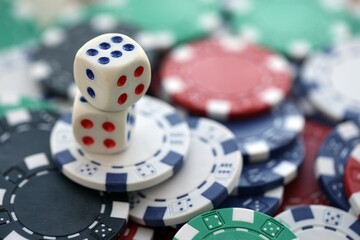 Dice game on the poker table in the casino. A successful combination of dice brought a lot of winning chips