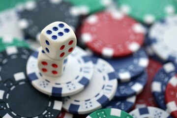Dice game on the poker table in the casino. A successful combination of dice brought a lot of winning chips