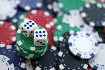 Dice game on the poker table in the casino. A successful combination of dice brought a lot of winning chips