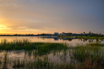 Evening landscape over lake water in southern tropical wetlands. Amazing Florida nature at sunset