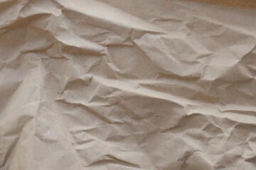 Brown crumpled recycled paper texture background. Kraft Paper