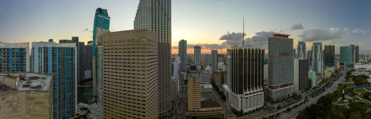 Evening urban landscape of downtown district of Miami Brickell in Florida, USA. Skyline with high skyscraper buildings and urban transportation system in modern american megapolis