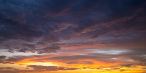 Obraz premium Getting dark at sundown. Sunset sky with scattered clouds of bright colors