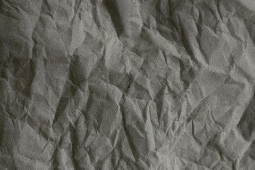 Brown crumpled recycled paper texture background. Kraft Paper