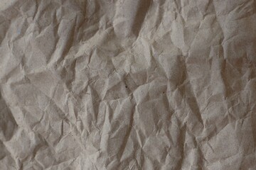 Brown crumpled recycled paper texture background. Kraft Paper