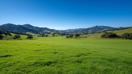 Obraz premium Rolling hills with blue sky and mountains. AI generated