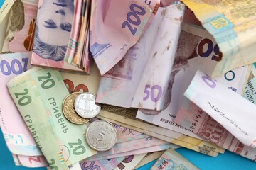 Big amount of different Ukrainian hryvnia money bills. Pile of crumpled ukrainian banknotes