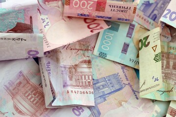 Big amount of different Ukrainian hryvnia money bills. Pile of crumpled ukrainian banknotes