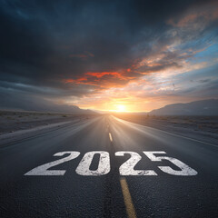 The year 2025 is painted on a long road at sunset.