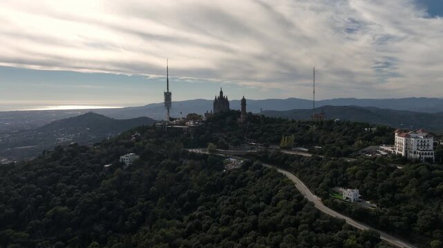 sunny day barcelona city famous mountain top park traffic road aerial panorama 4k spain 