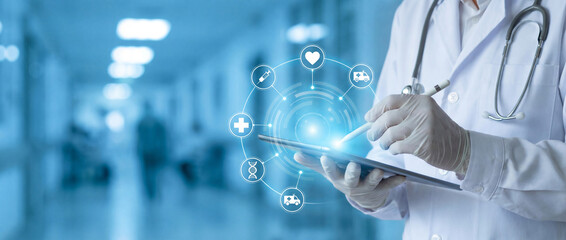 Doctor using digital tablet with futuristic medical interface and holographic icons in hospital corridor. Smart healthcare technology, telemedicine, and data analysis concept.