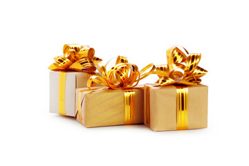 Golden ribbons  and Red color Christmas Gift Box white and golden lighting blur background