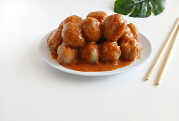 Cilok is a traditional food from Bandung, West Java, Indonesia. This food made from tapioca flour and serve with spicy peanut sauce