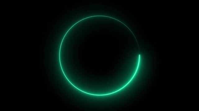 Glowing green circle rotating slowly on black background with neon light effects