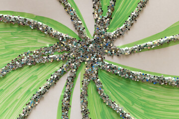 Glitter pinwheel on green art