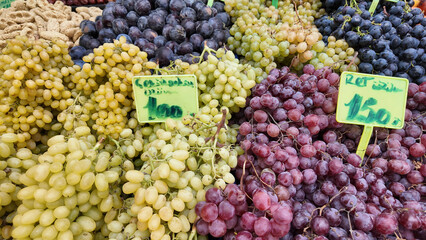 Fresh grapes displayed at a market stall in the afternoon