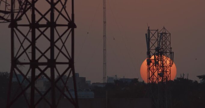 Jaipur, Rajasthan, India. Time Lapse Sunset Sun Shining. Sunset. Evening Sun Sets Over Horizon. Cityscape Urban Skyline. Bold Big Sun Close-up View. Timelapse, Time-lapse Sun Sets Against Backdrop Of