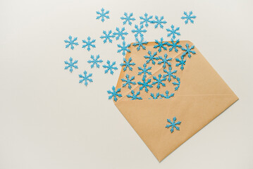 christmas tree made of paper. An envelope with snowflakes. Snowflakes in an envelope. Snowflakes flying out of the envelope.